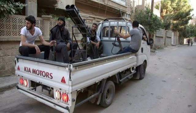 Terrorists in Syria, and previously in Libya, with the exception of stolen military vehicles, rely on improvised fighting vehicles of varying sophistication called "technicals" like the one pictured above. The larger flatbed featured in a recent video, launching a rocket similar to those found at the scene of an alleged August chemical weapons attack in Damascus, is also clearly an improvised fighting vehicle.