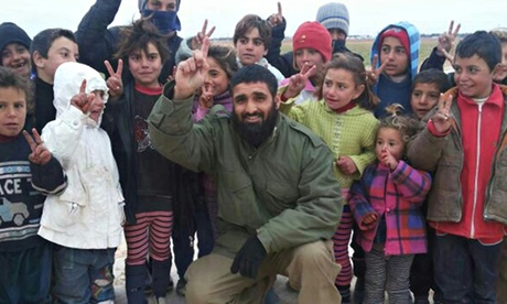 Abdul Waheed Majeed with Syrian children in a photo said to have been taken at a refugee camp on the border with Turkey. Photograph: PA