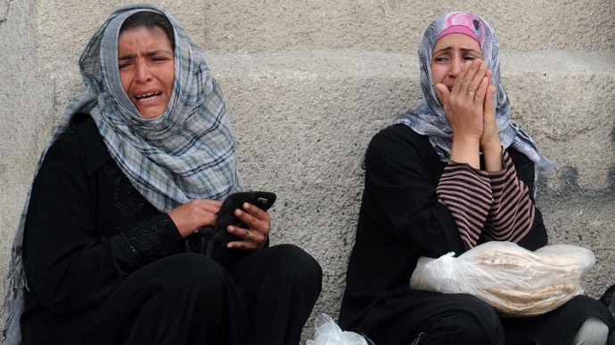 A handout picture released by the Syrian Arab News Agency (SANA) on May 15, 2013, shows protestors crying after unidentified armed groups opened fire on demonstrators as they marched in the Syrian capital Damascus in support of the right to return of Palestinian refugees who fled their homes or were expelled during various conflicts. (AFP/SANA)