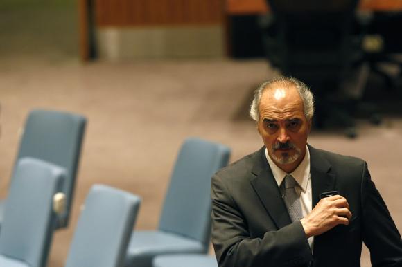  Syria's U.N. Ambassador Bashar Ja'afari walks through the hall during the U.N. Security Council meeting on Syria at the 68th United Nations General Assembly in New York September 27, 2013. Credit: Reuters/Keith Bedford 