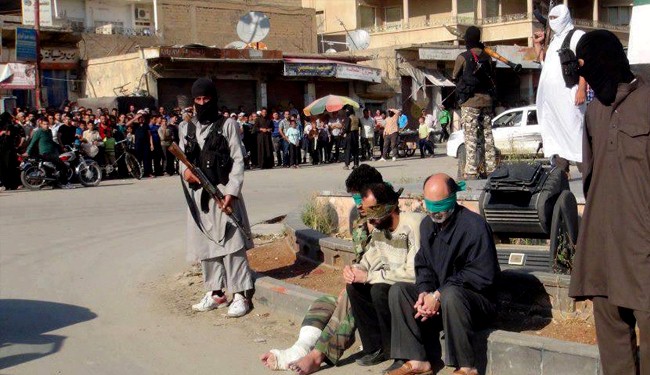 Public execution of three Syrian civilians by extremist militants in Raqqa 