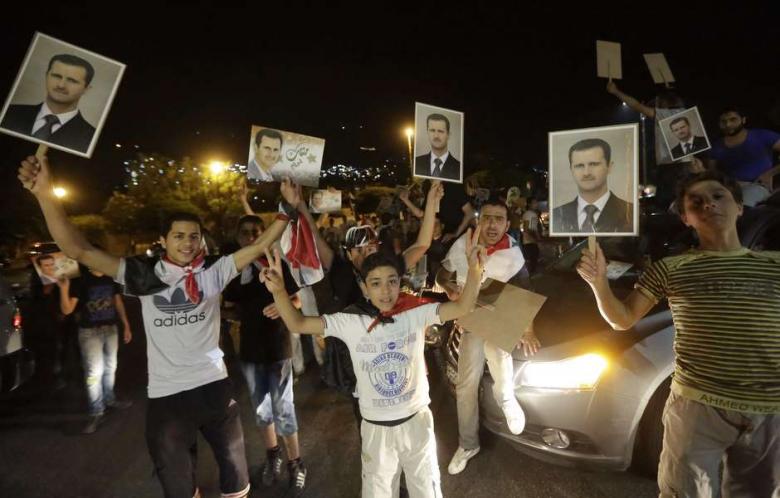 Bashar al-Assad won 88.7 percent of the vote in Syria's presidential election, parliament speaker Mohammed al-Laham said on Wednesday. "I declare the victory of Dr. Bashar Hafez al-Assad as president of the Syrian Arab Republic with an absolute majority of the votes cast in the election," Laham said in a televised address from his office in the Syrian parliament. Syria's constitutional court earlier said that turnout in Tuesday's election and an earlier round of voting for Syrian expatriates stood at 73.4 percent. A spokesman for the court had said 11.63 million Syrians voted in Tuesday's election inside the country and in an earlier round of voting outside Syria for refugees and expatriates. There were 15.85 million eligible voters in total, he said. Syrian officials had described the predicted victory as vindication of Assad's three-year campaign against those fighting to oust him. Voting took place in government-controlled areas of Syria, but not in large parts of northern and eastern Syria held by rebels. Fireworks and celebratory gunfire could be heard across parts of Beirut and Lebanon's Eastern Bekaa Valley with the announcement of Assad's victory.